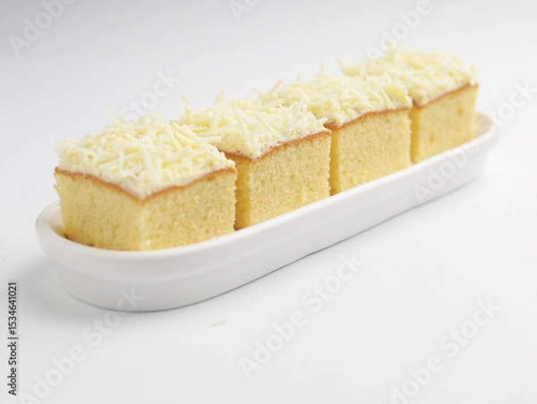 Fototapeta Vanilla sponge cheese cake on white background