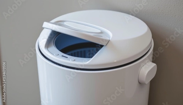 Fototapeta Modern white trash can with a lid and control panel.