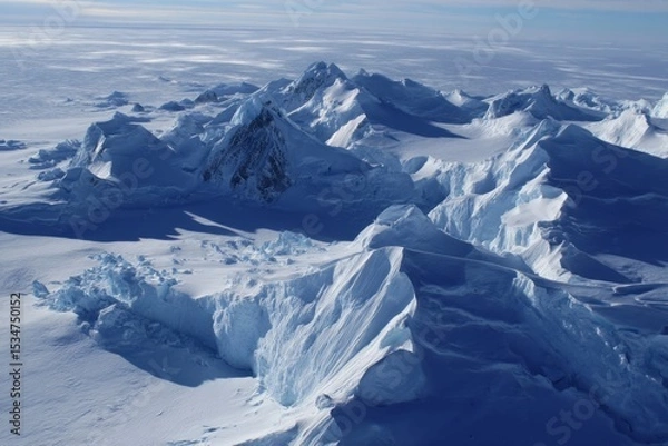 Obraz Expansive View of Majestic, Frozen Icy Mountain Peaks Stretching Across a Vast, Serene Polar Landscape, Capturing the Cold, Silent Beauty, Pristine Nature, and Tranquility of Remote Wilderness