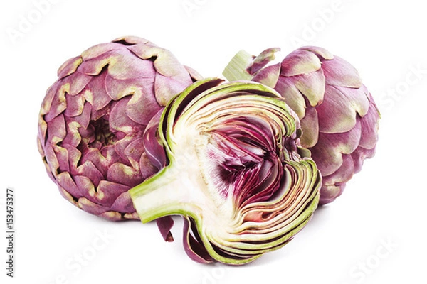 Fototapeta Whole and sliced fresh uncooked artichokes isolated on white background.