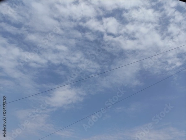 Fototapeta Blue sky background with small clouds natural composition panoramic image,Fondo de cielo azul con pequeñas nubes composición natural imagen panorámica,(35).