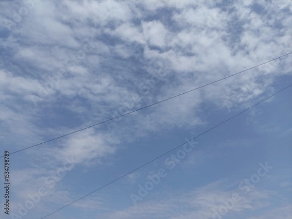 Fototapeta Blue sky background with small clouds natural composition panoramic image,Fondo de cielo azul con pequeñas nubes composición natural imagen panorámica,(36)
