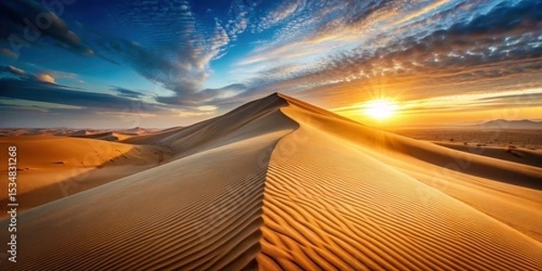 Fototapeta A majestic sand dune stretches towards the horizon