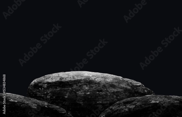 Obraz Stone podium on dark black background.