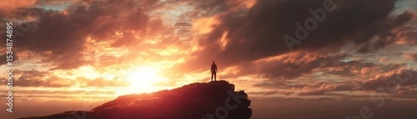 Obraz Silhouette of a person on a cliff at sunset.