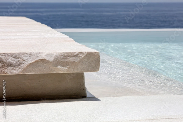 Obraz Serene infinity pool edge with stone details overlooking calm ocean waters