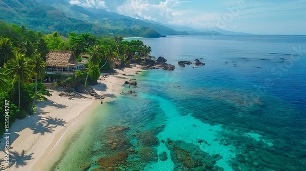 Obraz A secluded tropical beach with coconut trees, colorful coral reefs, and crystal-clear water