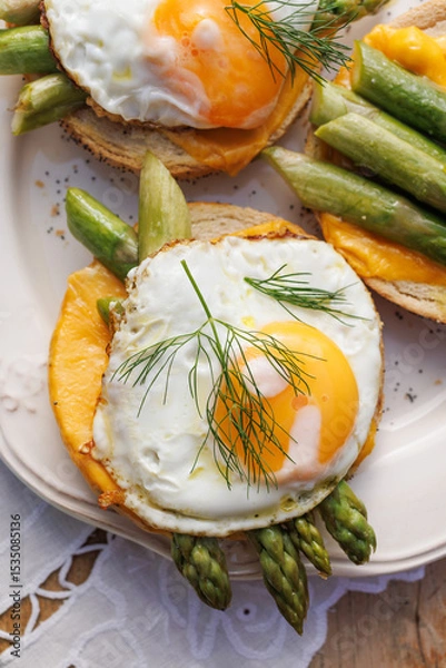 Obraz Vegetarian sandwich with fried egg and green asparagus, top view