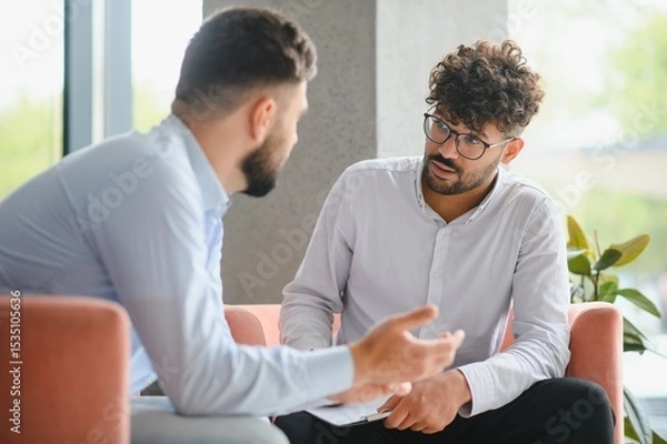Fototapeta Psychologist listening to patient talking about problems during therapy session