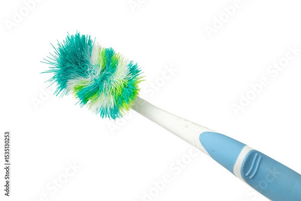 Obraz old used toothbrush on a white background