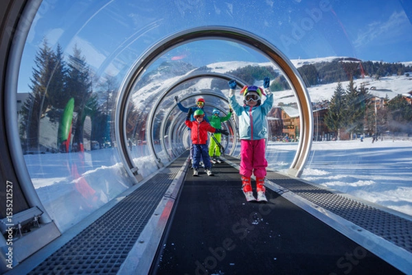 Obraz Family enjoys skiing adventure on a snowy ascend in lift tunnel