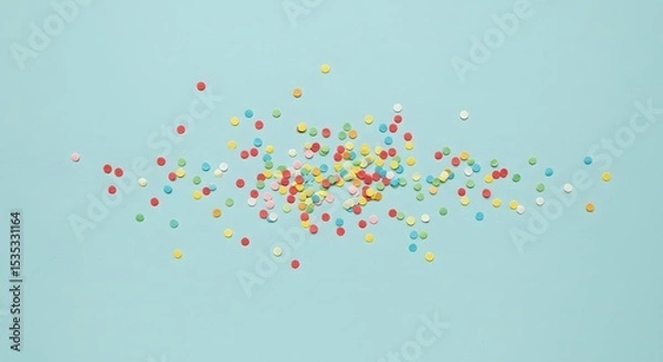 Fototapeta Colorful Sprinkles on Light Blue Background Photograph