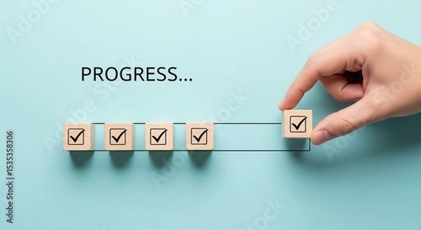 Fototapeta Checklist and task progress tracking concept. A hand placing the final checkmark on wooden blocks in a progress bar, task completion, productivity, goal setting, and efficient project management. 