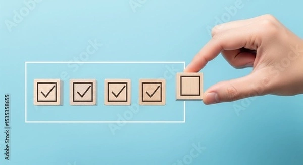 Fototapeta Checklist and task progress tracking concept. A hand placing the final checkmark on wooden blocks in a progress bar, task completion, productivity, goal setting, and efficient project management. 