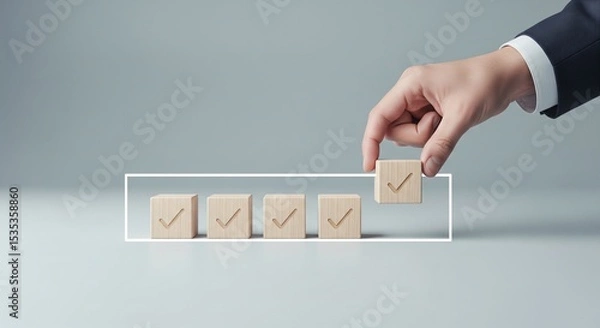 Fototapeta Checklist and task progress tracking concept. A hand placing the final checkmark on wooden blocks in a progress bar, task completion, productivity, goal setting, and efficient project management. 