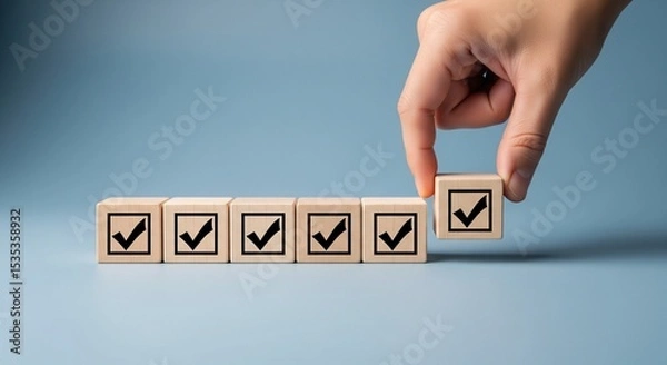 Obraz Checklist and task progress tracking concept. A hand placing the final checkmark on wooden blocks in a progress bar, task completion, productivity, goal setting, and efficient project management. 