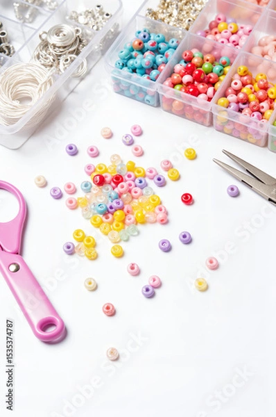 Fototapeta Colorful Friendship Bracelet Making Kit - Beads, Letter Charms, and Threads on White Background for International Friendship Day Crafting Projects