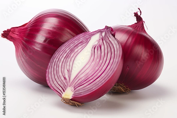 Fototapeta Two whole red onions and a halved purple onion, with the top and bottom visible on a white background.