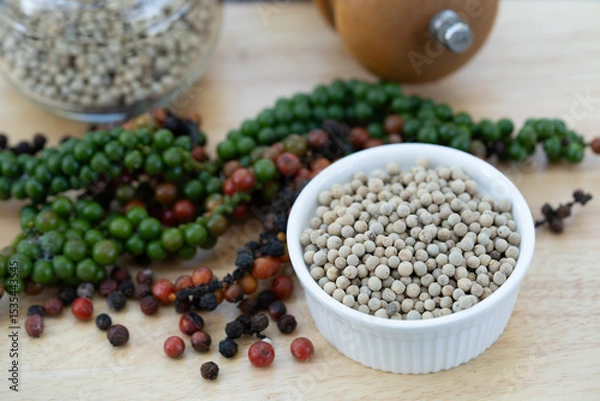 Obraz Vibrant peppercorns and aromatic herbs: nature's essence for healthy living and flavorful dishes. Perfect for culinary and wellness themes.