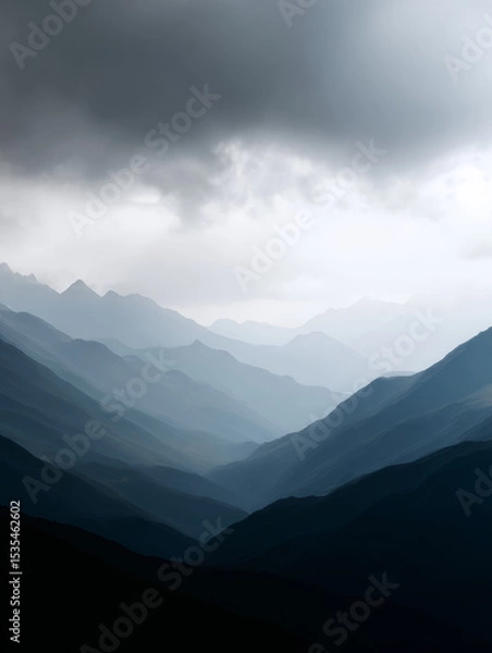 Obraz distant mountains barely visible through dense low-hanging clouds