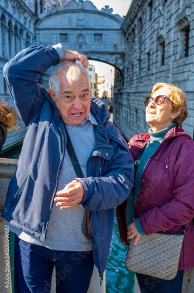 Fototapeta Tourist reacting after being hit by pigeon droppings near the Bridge of Sighs, Venice