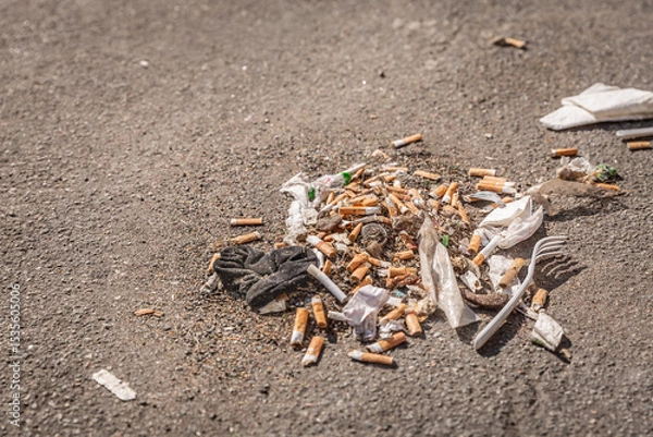 Obraz Garbage, litter and cigaret buds on a street, environmential and social issue concept with littering