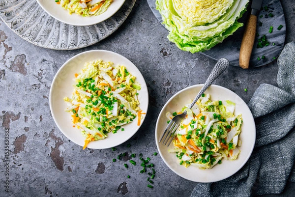 Obraz Chinese cabbage salad with carrots and green onions