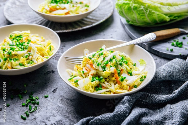 Obraz Chinese cabbage salad with carrots and green onions