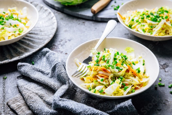 Obraz Chinese cabbage salad with carrots and green onions
