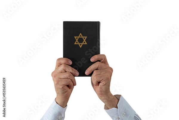 Fototapeta Hands and Hebrew Book Talmud with Star of David on a dark cover on isolated background. Rabbinic Judaism, Studying Jewish religious law. Torah, Hebrew Bible. Holy Scripture containing the word of God