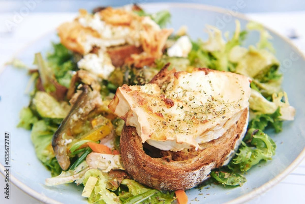 Fototapeta Close up image of warm goat cheese salad