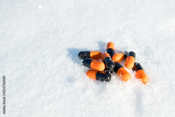 Obraz A pile of pills are scattered on the snow