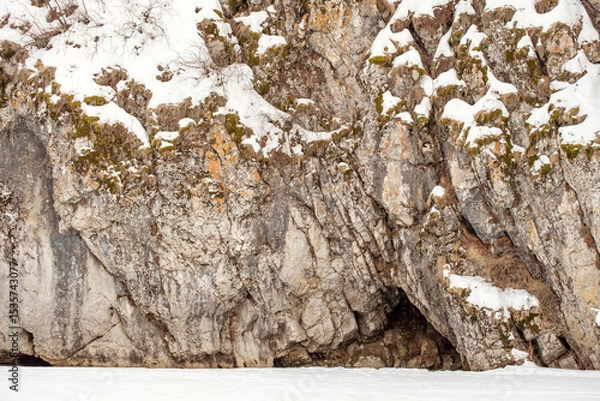 Obraz A rocky cliff covered in snow