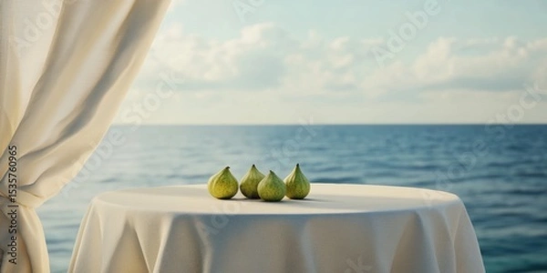 Fototapeta A serene seaside setting featuring a table draped in white, adorned with fresh green figs, perfect for culinary themes, relaxation, or luxury experiences by the ocean.