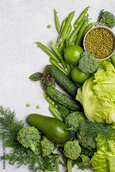 Fototapeta Fresh green vegetables in assortment top view, free space for copy. Healthy lifestyle, detox, flat lay.