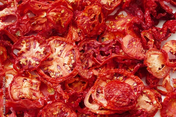 Fototapeta drying tomatoes in the sun, finely chopped tomatoes are dried on the balcony,