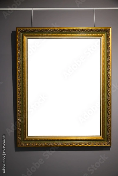Fototapeta In an art museum, a picture frame with an empty canvas hangs on the wall