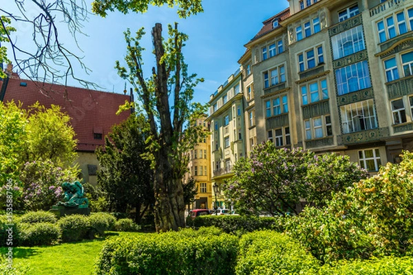 Fototapeta A view across a park in the Jewish quarter of Prague in springtime