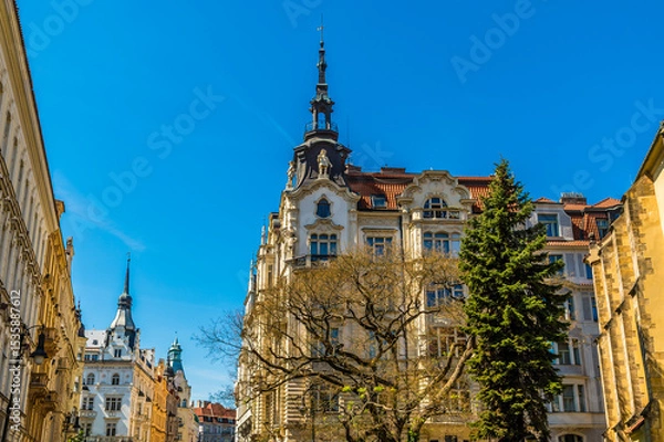 Fototapeta A view of ornate buildings with spires around the old town square in central Prague in springtime