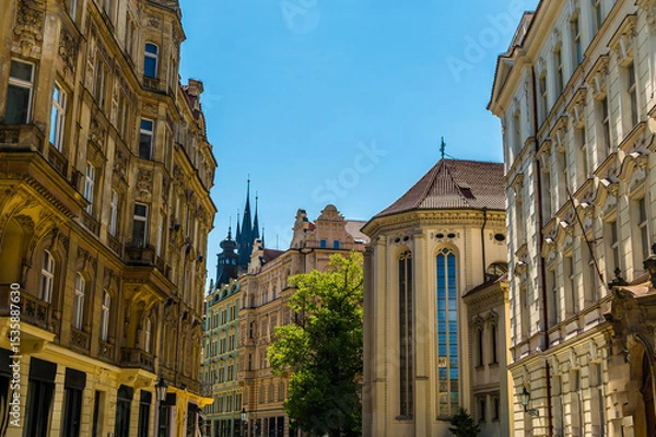 Fototapeta A view of ornate buildings in a street in the Jewish quarter of Prague in springtime
