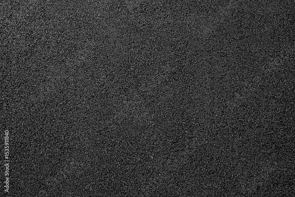 Fototapeta Close-up texture of smooth, freshly laid asphalt pavement with uniform dark gray color and fine