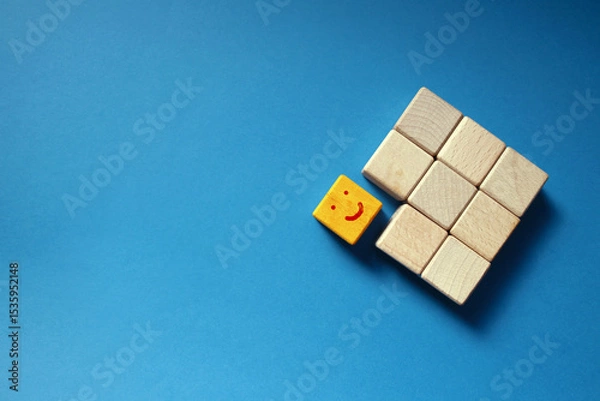 Fototapeta One Wooden Block Breaking Away from the Group