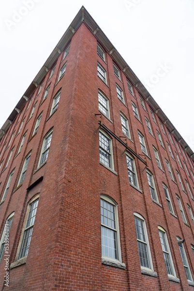 Fototapeta low angle view on old building with brick wall