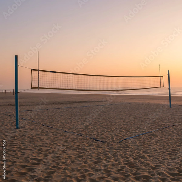 Fototapeta A volleyball net on a quiet, sandy beach against a soft-hued sky at sunrise or sunset. A peaceful scene of summer sports and recreation.
