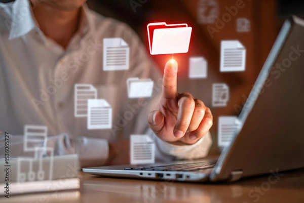 Fototapeta Businessman Accessing Digital Documents and Files on Laptop