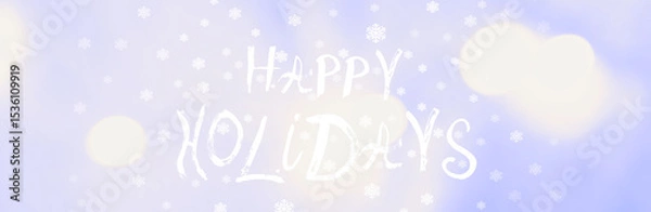 Fototapeta Happy Holidays saying, handwritten text. Snowflakes on soft blue background, light flares. Congratulating. Wide banner