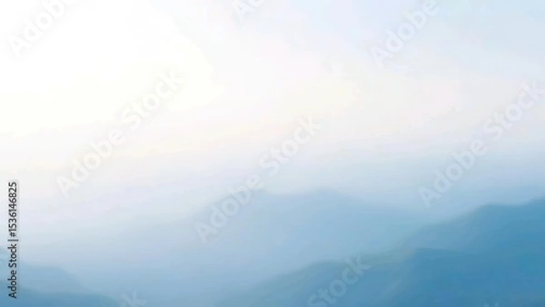 Fototapeta Soft Blue Mist Over Layered Mountains in a Tranquil Landscape