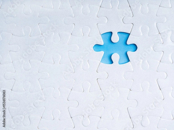 Obraz Business solution, solvings and problems, recruitment, creativity concept. Missing piece on blue empty space, gap surrounded with many white blank jigsaw puzzle background, minimalist composition.