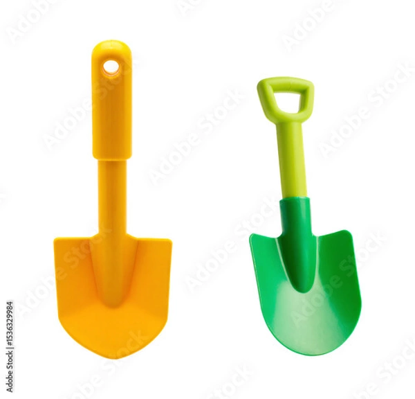 Obraz Yellow and green plastic children's toy shovels set for beach sand scooping on an isolated transparent background.