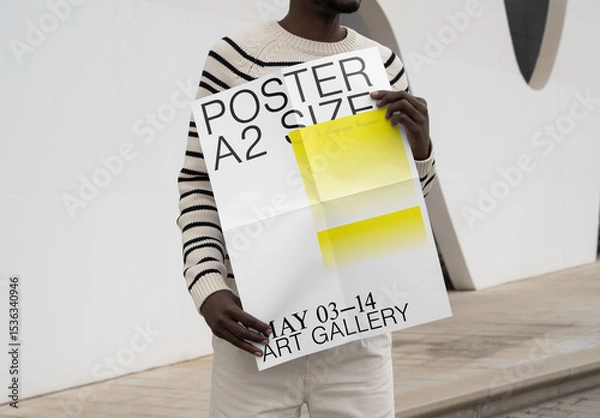 Fototapeta Mockup Of Man Holding Customizable A2 Poster